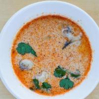 Tom Kha Soup · Coconut milk soup with chicken, Thai herbs & mushrooms