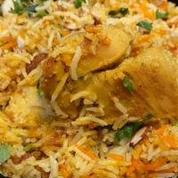 Chicken Biryani · Selected chicken pieces sauteed with basmati rice, vegetables, nuts and raisins; garnished w...