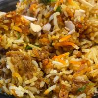 Lamb Biryani · Boiled pieces of juicy lamb sauteed with steamed basmati rice, vegetables, Indian spices, ca...