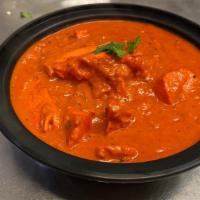 Makhni Chicken · Tender boneless pieces of tandoor chicken sauteed with ginger, onions and garlic in a sauce ...