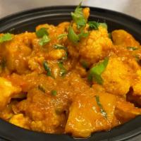 Aloo Gobhi · Cauliflower and potatoes cooked with herbs and spices. Served with basmati rice.