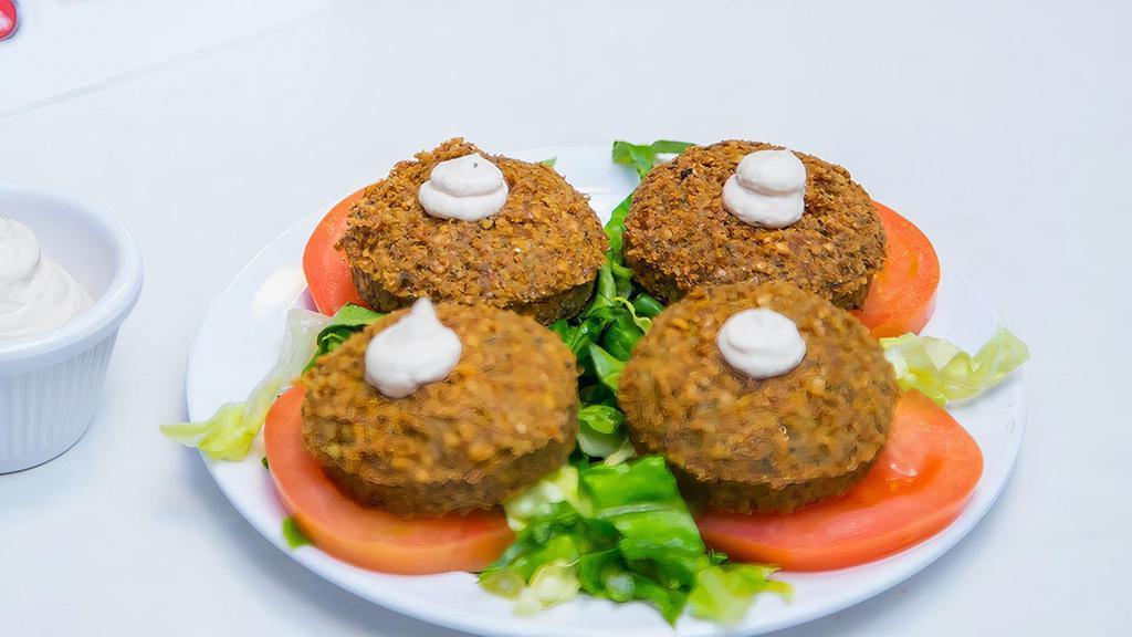Falafel (5) · 5 pcs -Deep fried chickpeas mixed with parsley, onions, garlic & cilantro.