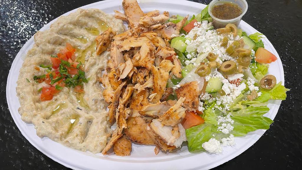 Chicken Shawarma · Chicken breast marinated with lebanese spices shaved off a rotating spit served with garlic sauce.