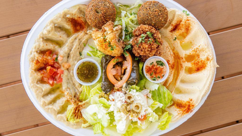 Vegetarian Plate · Hummus, baba ghannouj, grape leaves (2pcs), cauliflower, falafel (2 pcs), & greek salad – 2 sides not included.