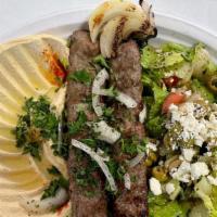 Kafta Kabob · 2 skewers of ground beef mixed with onions, parsley, kafta spices, served with grilled tomat...