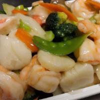 Seafood Delight · Shrimp, scallop, crab meat with mixed vegetable, sauteed in clear white sauce. Served w.  wh...