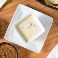 Iguana Dip & Chips · Smooth and creamy white pepper cheese with spinach.