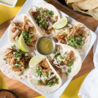 Street Tacos · Six tacos with carnitas pork, chicken, or steak, diced onions and cilantro. Served with toma...