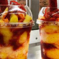 Mangonada · Pure de mango congelado, chamoy, tajin, mango en trosos, lucas, banderilla. /  Frozen Mango ...