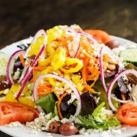 Classic Greek · Crisp romaine lettuce, mixed greens, cucumbers, tomatoes, onions, banana peppers, topped wit...