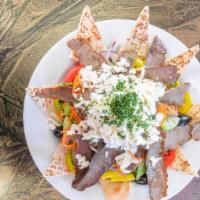 Jbd Gyro Salad · Sliced pita, mixed greens, onions, tomatoes, kalamata olives, freshly roasted gyro meat and ...