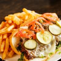 Steak & Cheese Sub · Thinly sliced seasoned steak sautéed with fried onions, lettuce, tomato and mayo.
