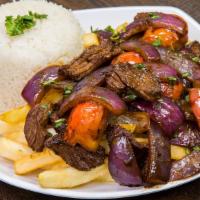 Lomo Saltado · tender steak with onions, tomatoes, cilantro served over fries and white rice
(No Substituti...
