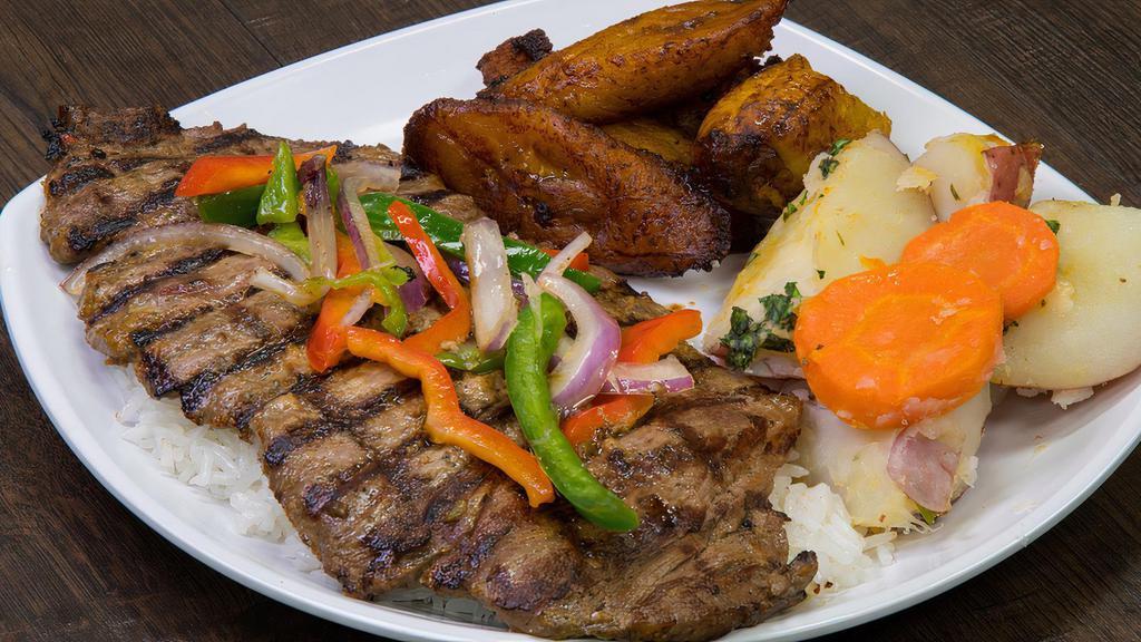 Carne Asada · tender steak with green peppers, red peppers and onions served with two sides
