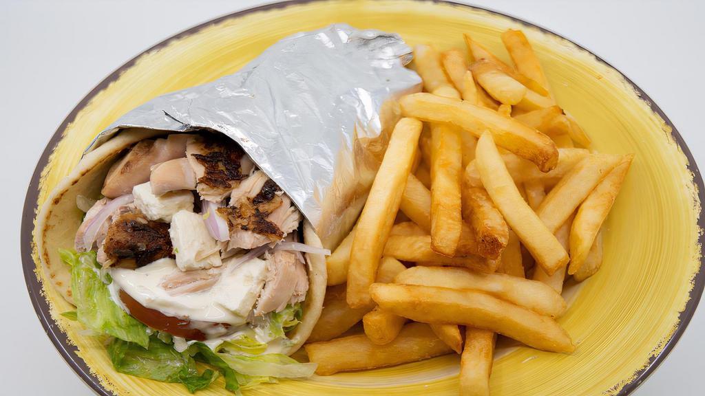 Gyro · lamb or chicken with tzatsiki sauce, lettuce, tomatoes, onions and feta cheese wrapped in pita bread