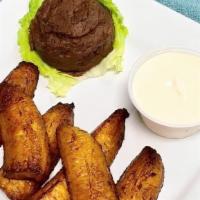 Fried Plantain · Fried plantain, refried beans and sour cream.