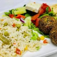 Falafel (Platter) · Served with side Greek salad and choice of side. Crisp-fried balls of ground chickpea, quino...