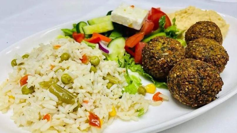 Falafel (Platter) · Served with side Greek salad and choice of side. Crisp-fried balls of ground chickpea, quinoa, garlic, and fresh herbs, served with hummus.