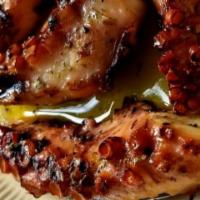 Octopus · Grilled; dressed with olive oil and red wine vinegar.