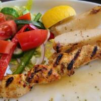 Chicken Souvlaki · Marinated and grilled on a skewer, served with tzatziki and side Greek salad.