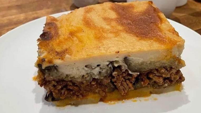 Moussaka · Thinly sliced layers of eggplant, potatoes, and seasoned local ground beef topped with bechamel.