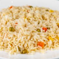 Pilafi · Rice with carrot, celery, and peas.