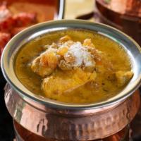 Korma · Curry made with spices and cooked in a creamy sauce to a slightly sweet flavor.