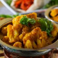 Aloo Gobi · Curry made of potatoes and cauliflower cooked with a touch of cream.