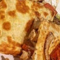 Quesadilla Norteña · Authentic quesadilla with your choice of meat and melted Chihuahua cheese, diced onion, fres...
