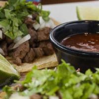 Pork Carnitas · Tender pork served with rice, choice of black or refried beans and tortillas. Garnished with...