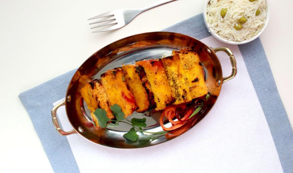 Paneer Tikka · Cottage Cheese marinated with yogurt, cream, turmeric & Indian spices.