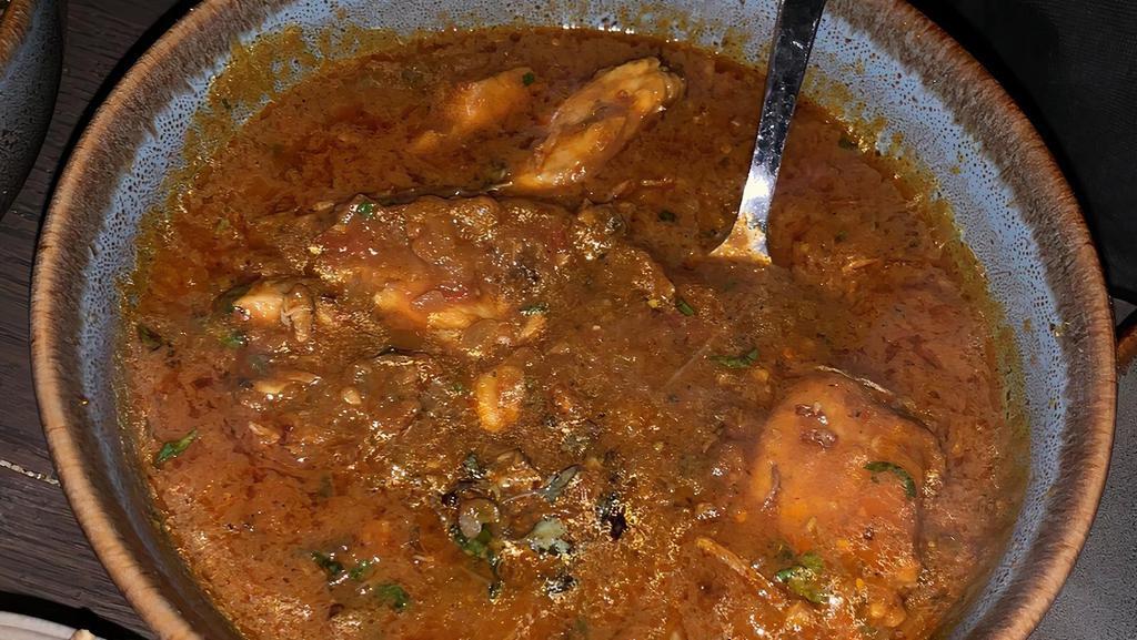 Goan Fish Curry · A Goan specialty fish curry cooked with fresh coconut milk, Indian herbs & spices.