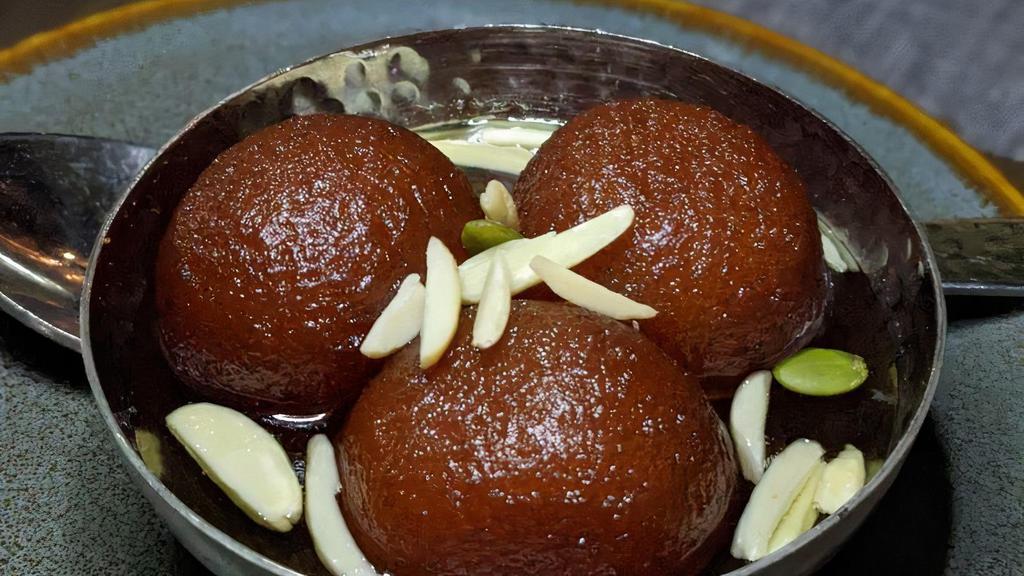 Gulab Jamun · A light warm pastry made from milk & soaked in honey.