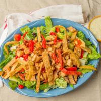 Fiesta Salad · Diced honey lime chicken and tortilla strips tossed with mixed greens, tomatoes, cucumbers, ...