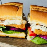 Fish Sandwich With Fries · Toasted bread, tartar sauce, lettuce, tomatoes, red onion, and fried fish. Served with a sid...