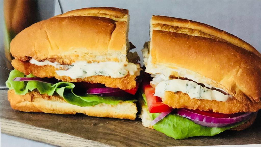 Fish Sandwich With Fries · Toasted bread, tartar sauce, lettuce, tomatoes, red onion, and fried fish. Served with a side of French Fries and Ketchup.