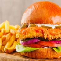 Crispy Fried Chicken Sandwich Served With French Fries · Toasted brioche bun, creamy chipotle sauce, lettuce, tomatoes, onion, fried breaded chicken ...