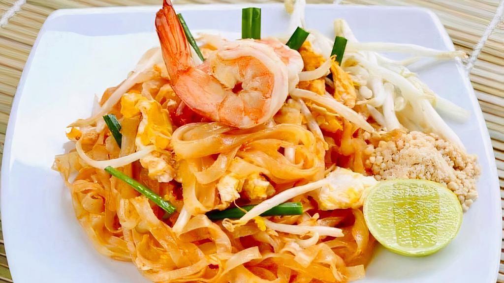 Pad Thai · Stir-fried thin rice noodles with your choice of meat (chicken, beef, or shrimp) tofu or veggies mixed with egg,  garlic chives, bean sprouts, and our house special sauce.  Ground peanuts and chili flakes on the side.