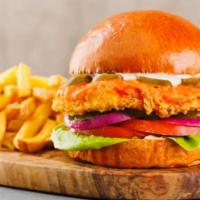 Chipotle Crispy Fried Chicken Sandwich Served With French Fries · Toasted brioche bun, creamy chipotle sauce, lettuce, tomatoes, onion, fried breaded chicken ...