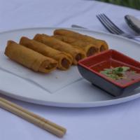 Spring Rolls · Deep-fried 3 veggie spring rolls served with Thai chili sauce.