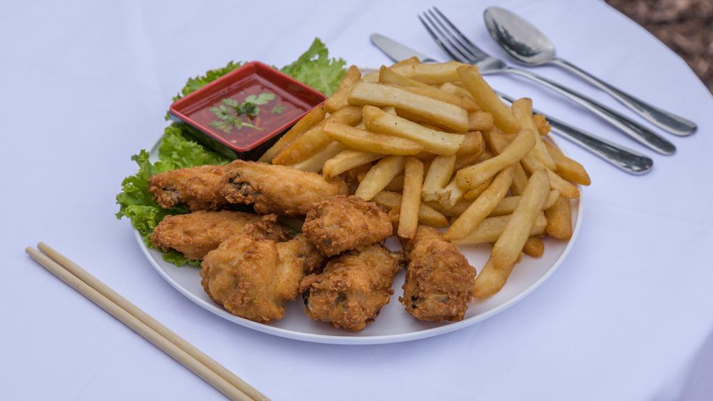 Chicken Wings With French Fries · Deep-fried chicken wings served with your choice of sauce and a side of French Fries with Ketchup.