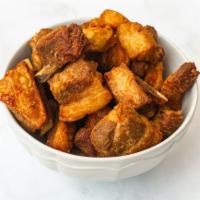 Crispy Pork Bites & Yuca Fries · slow cooked for several ours and fried to a crisp, these crispy tender bites Served with yuc...