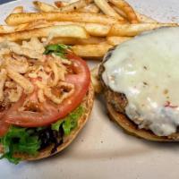 Turkey Burger · Our 8 oz. housemade turkey burger with lettuce, tomato, and crispy onions topped with cheese...