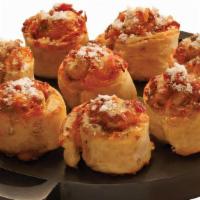 Bacon Cheddar · Our signature dough with cheddar cheese and bacon rolled and baked to perfection. Served wit...