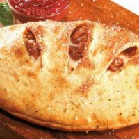 Spicy Italian Stromboli · Italian sausage, Genoa salami, pepperoni, capicola and ham baked with banana peppers and moz...