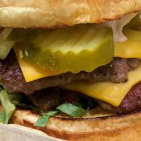 Double Stack Burger (Prepared Med Well)  · Two local angus patties, american cheese, pickles, lettuce and special sauce.