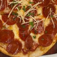 Pepperoni Flatbread · San marzano tomato sauce, mozzarella, pepperoni, hot honey, grana padano cheese.