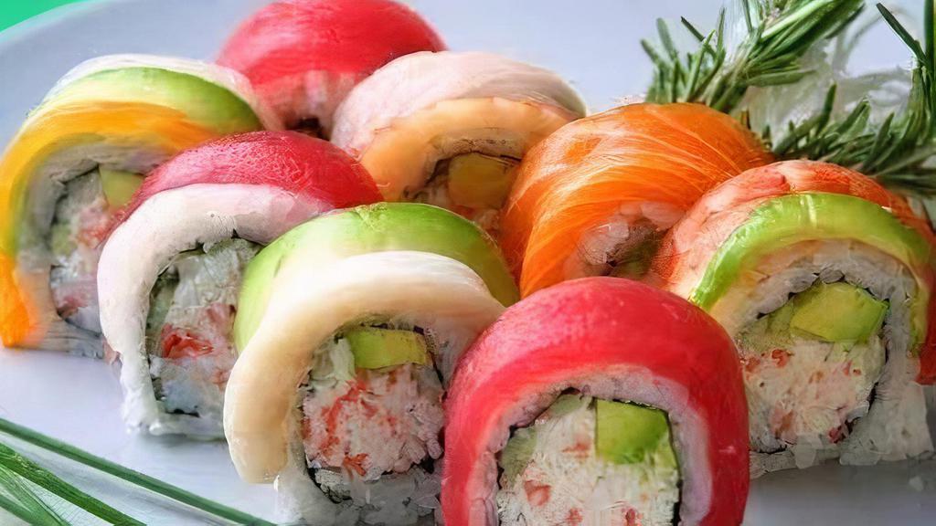 Rainbow Roll · Crab meat, avocado, cucumber, with tuna, salmon, white fish on top.