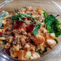 Spicy Salmon Bowl · Fresh salmon, cucumbers, green onions, cilantro, pickled serrano peppers mixed with shoyu an...