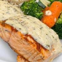Grilled Salmon · Creamy garlic butter, rice pilaf, sautéed seasonal veggies.
